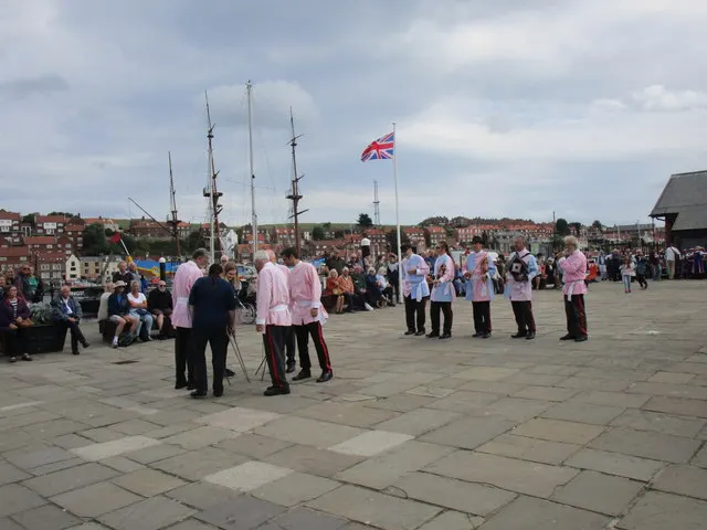 The Goathland Plough Stots dancing in their pink and white, on a visit to Whitby