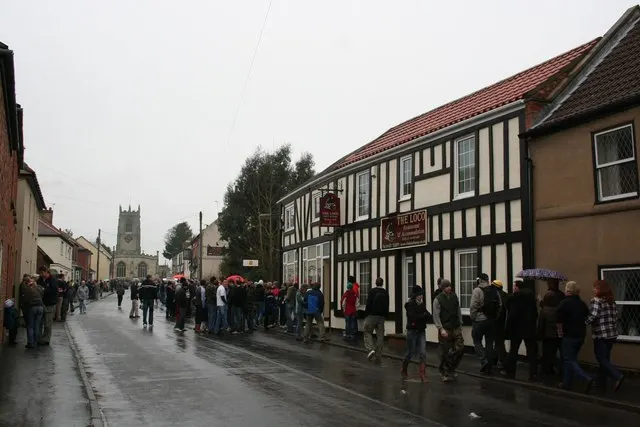 Spectators gather outside the Loco pub in Haxey on Hood Day.