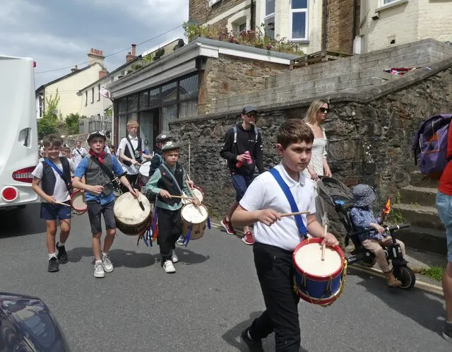Drummers and costumed followers process through Combe Martin's streets during the Hunting of the Earl of Rone.