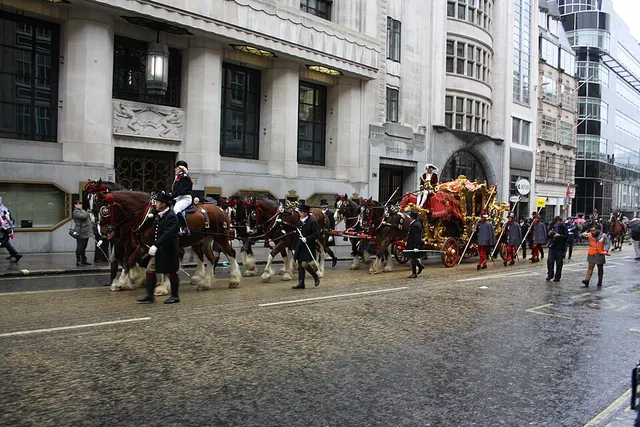 The Lord Mayor's gold State Coach, drawn by horses, processes through central London during the Lord Mayor's Show.