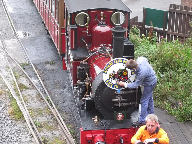 Volunteers polish the Talyllyn Railway locomotive Dolgoch, decorated with a Race the Train medallion, ahead of the annual event at Tywyn.