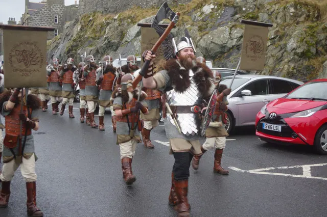 The Jarl Squad marches in Viking costume through Lerwick during Up Helly Aa.