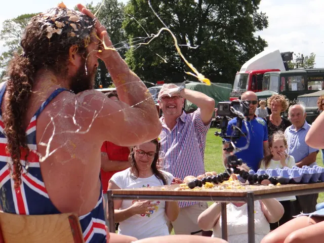 A competitor drenched in raw egg after a throw-and-catch attempt at the World Egg Throwing Championships in Swaton.