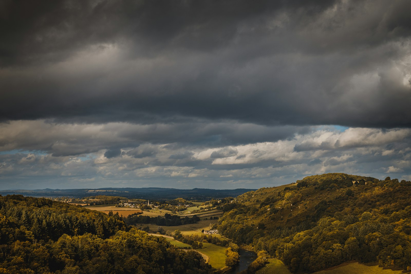Photo of a landscape with hills and trees.