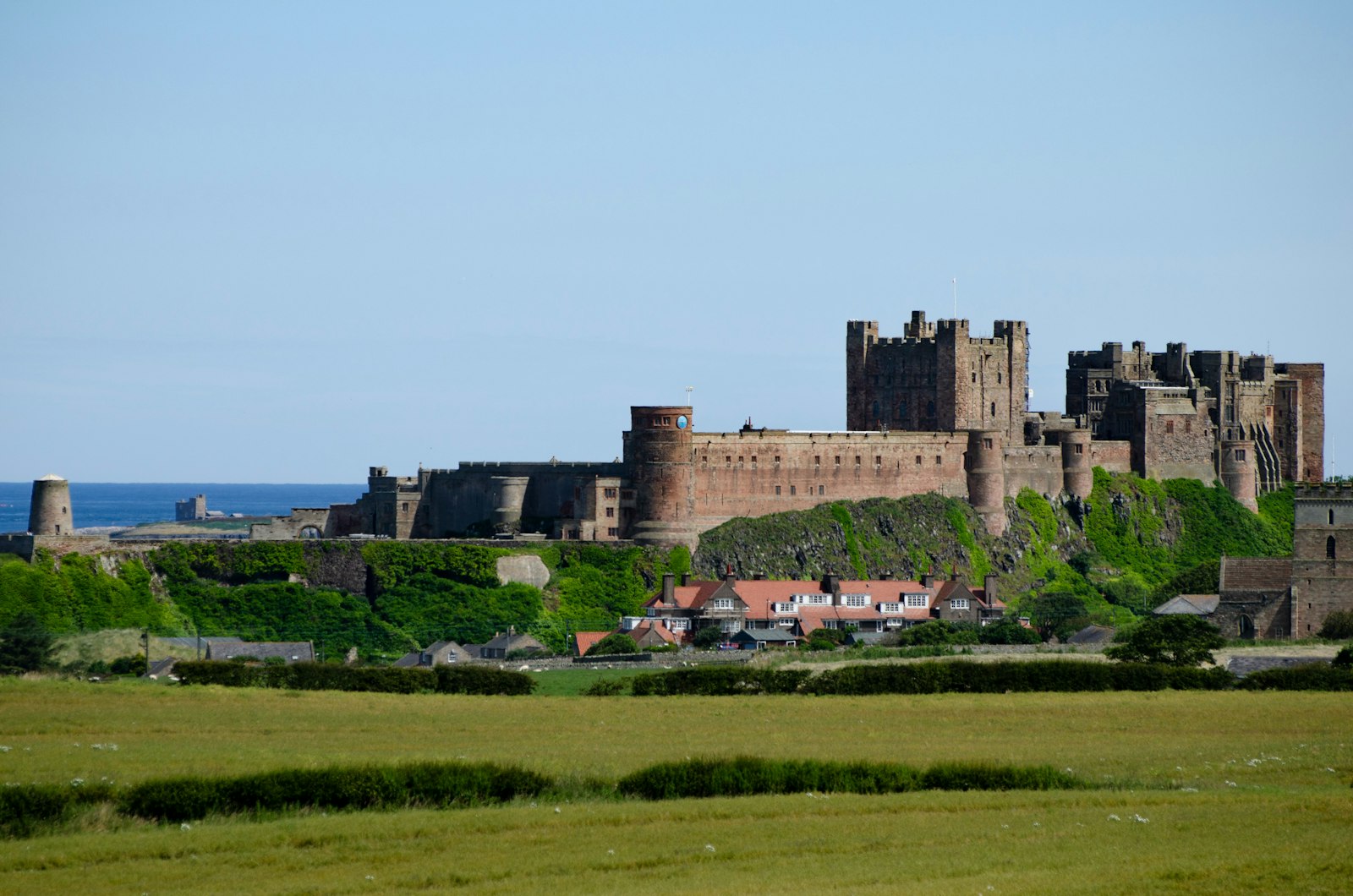 Photo of Bamburgh Castle above the Northumberland coast.