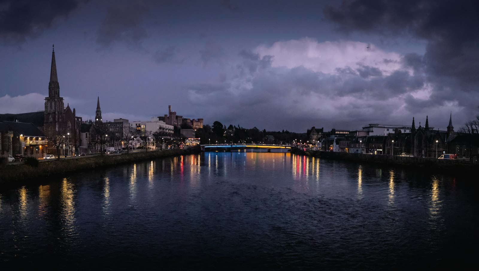 Photo of a body of water with buildings along it.
